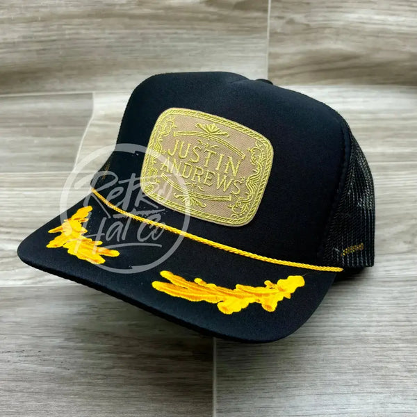 Justin Andrews Gold Buckle Patch On Black Meshback Trucker W/Scrambled Eggs Ready To Go