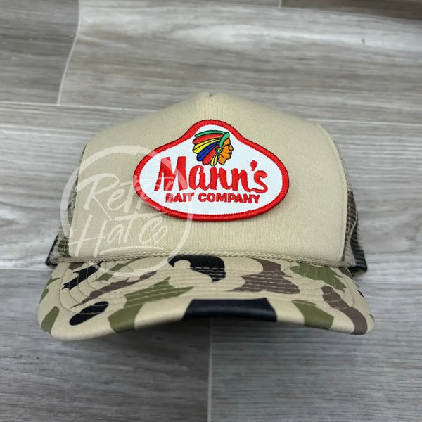Mann’s Bait Co. Patch On Solid Front Beige / Camo Meshback Trucker Hat Ready To Go